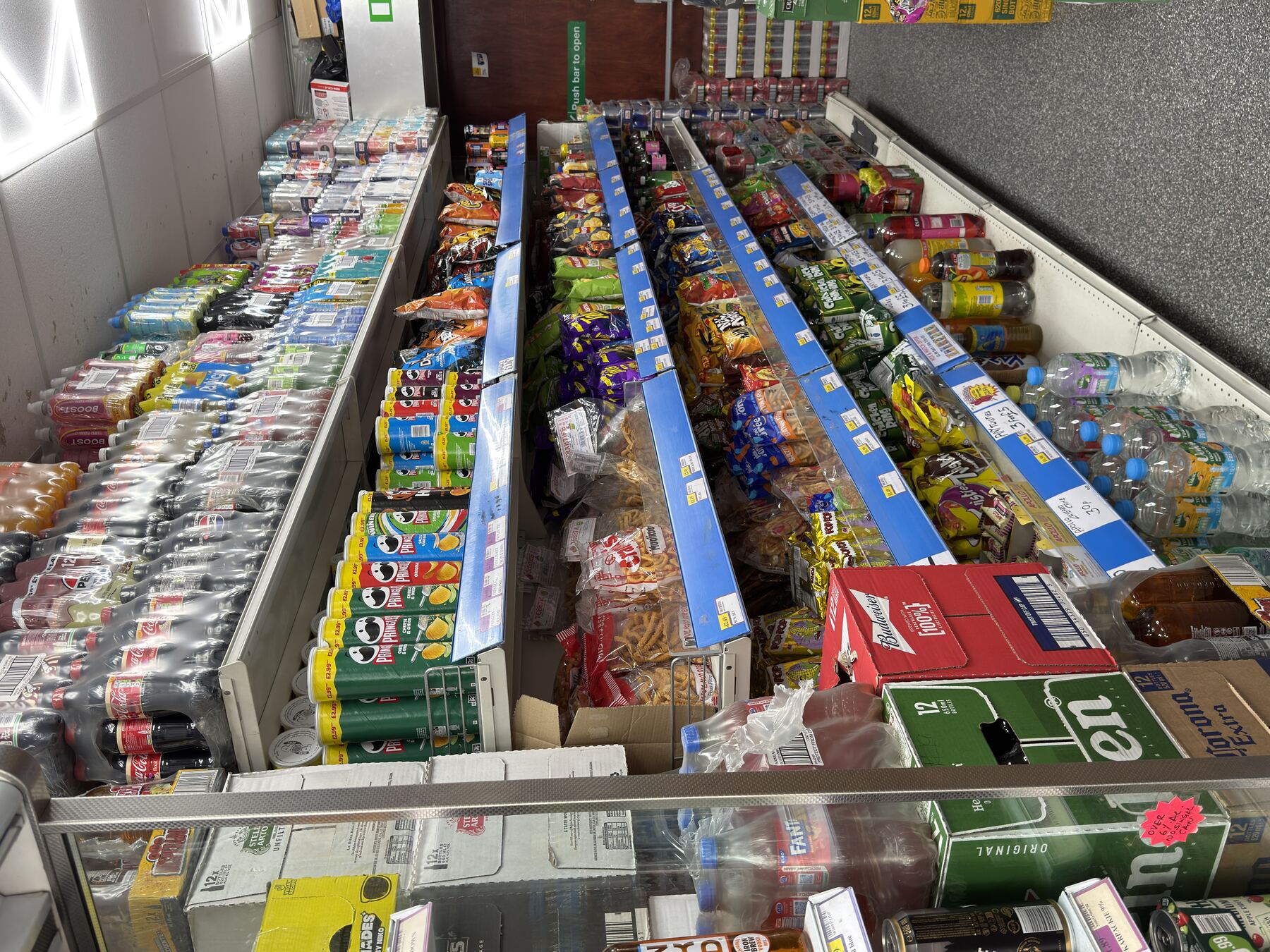 Shelf of crisps, sweets and snacks